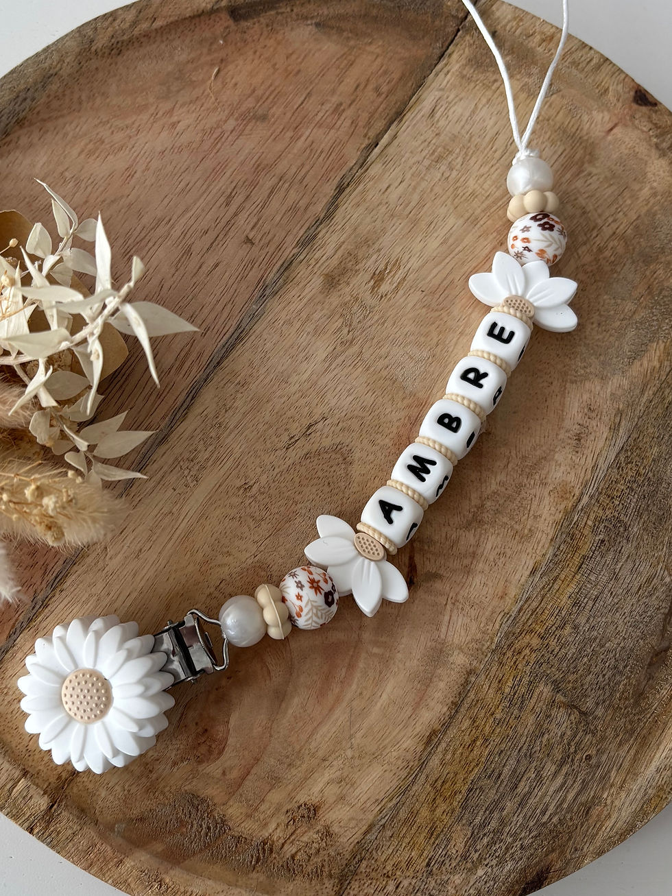 Attache tétine fleur