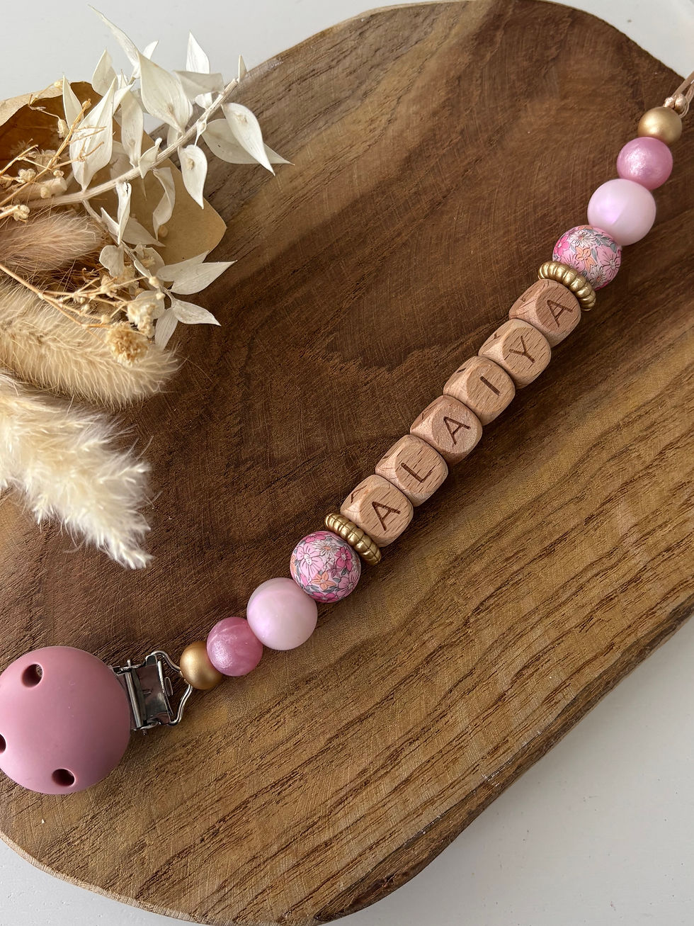 Attache tétine fleur