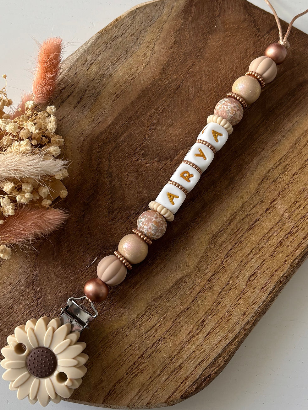 Attache tétine fleur