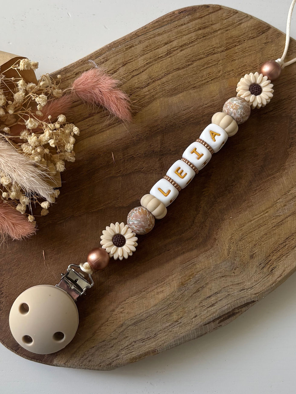 Attache tétine fleur