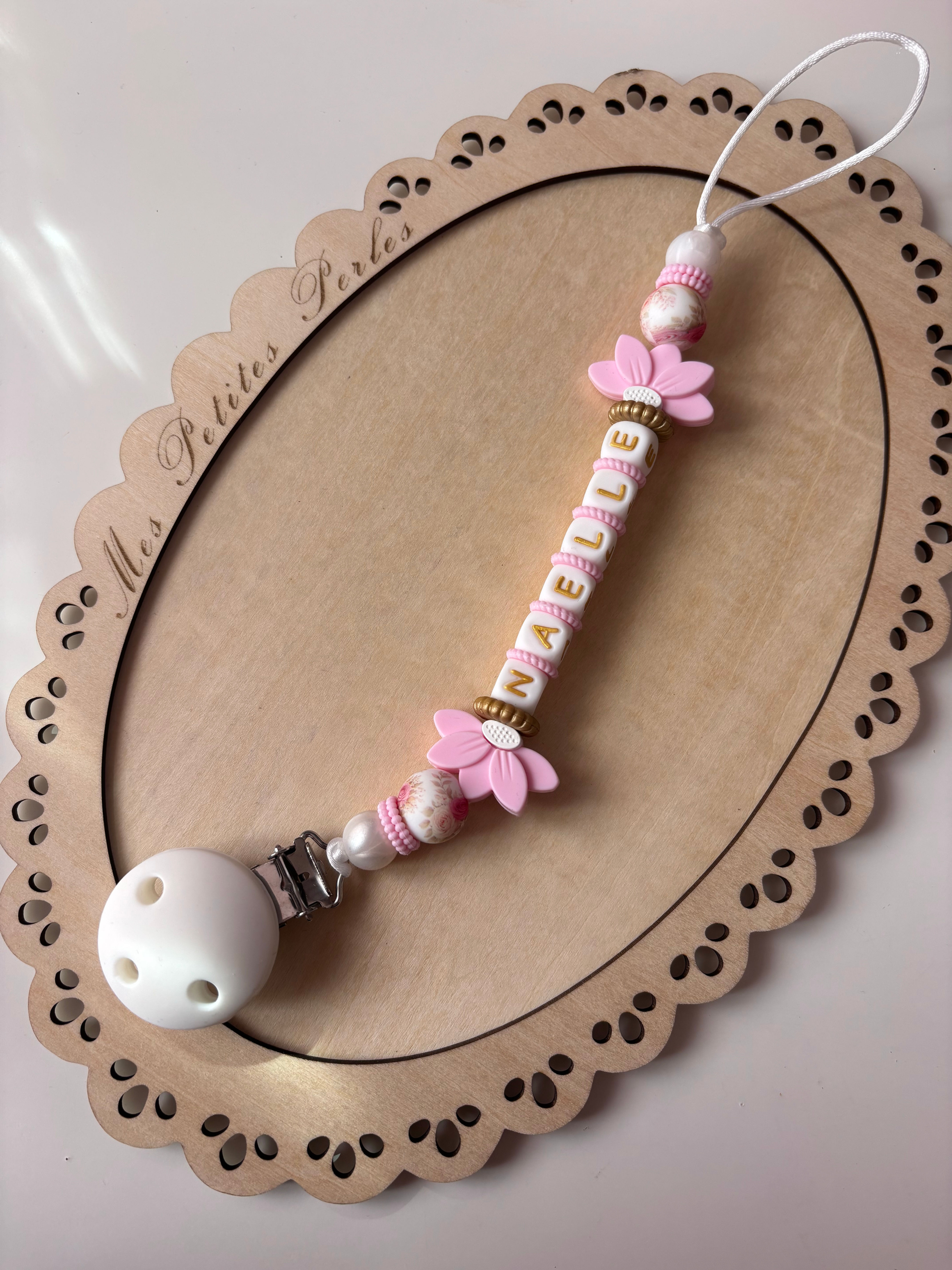 Attache tétine fleur