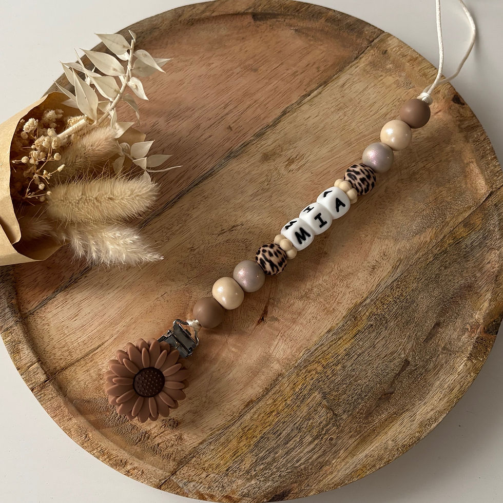 Attache tétine fleur