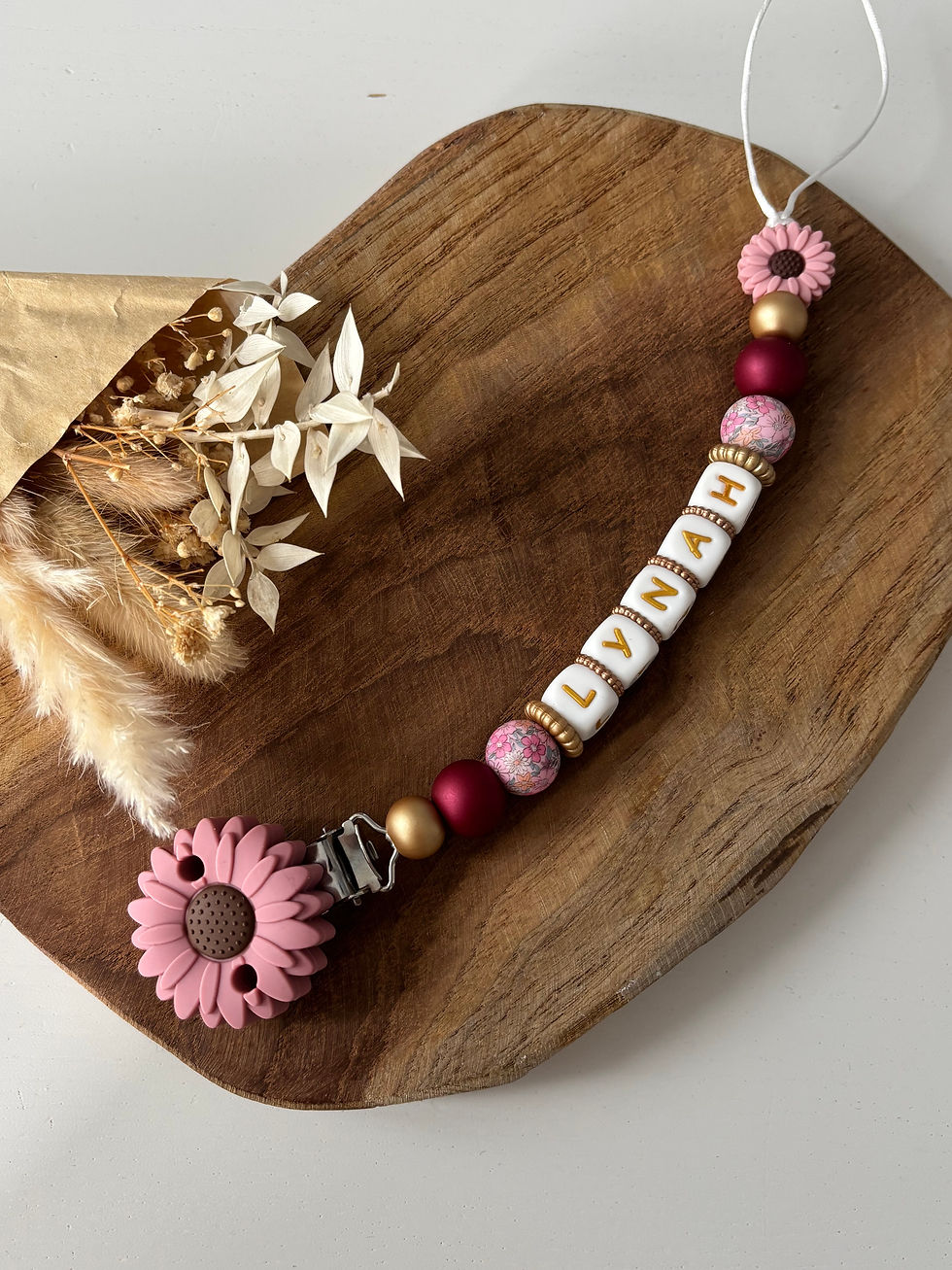 Attache tétine fleur