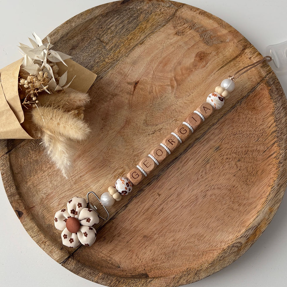 Attache tétine fleur