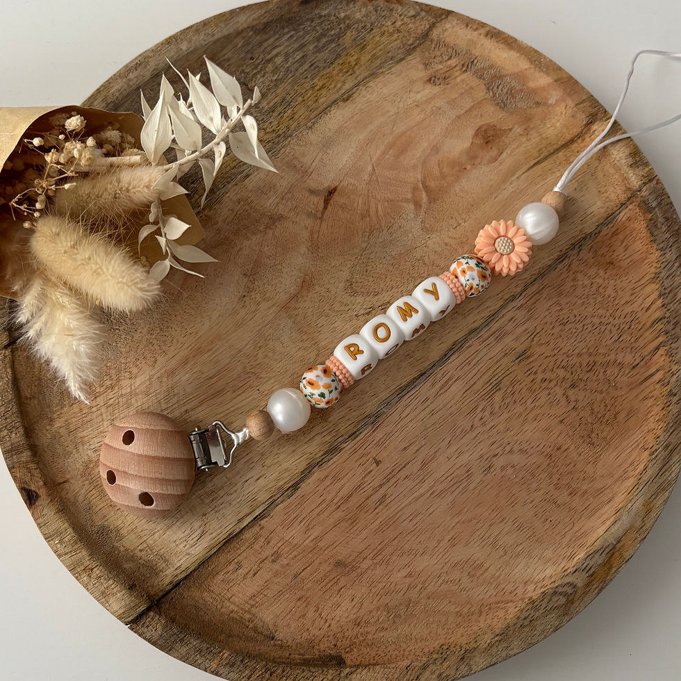 Attache tétine fleur