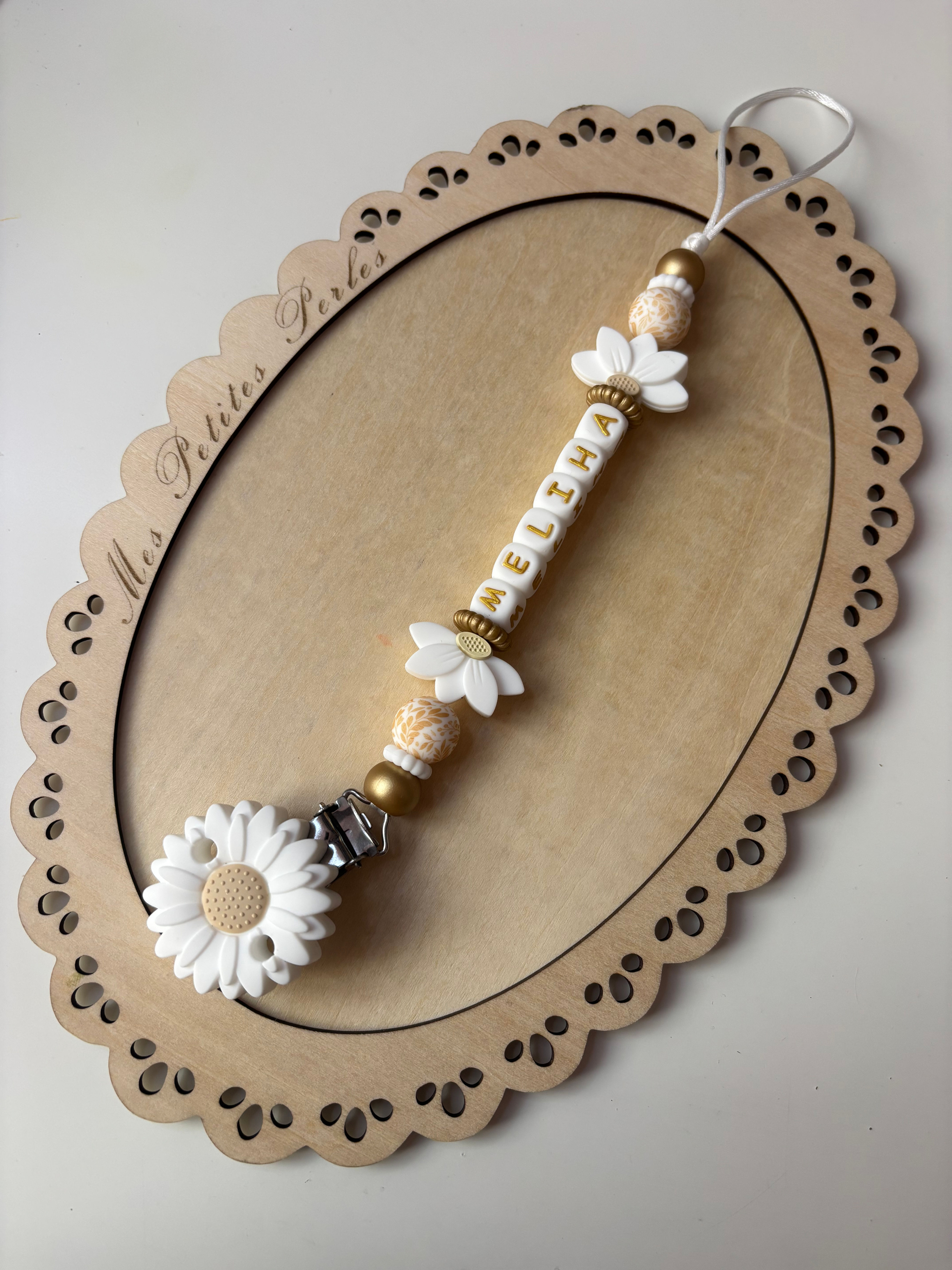 Attache tétine fleur
