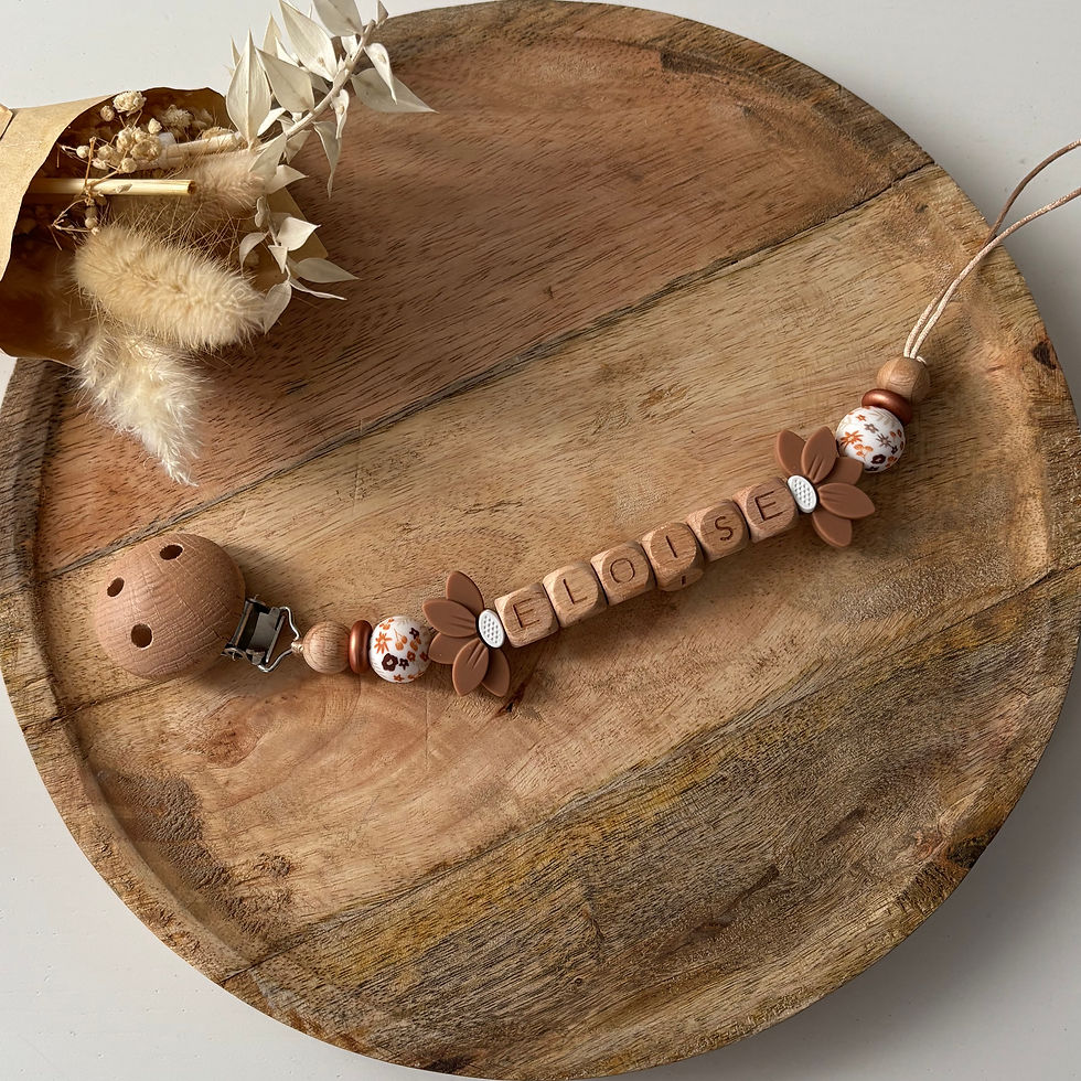 Attache tétine fleur