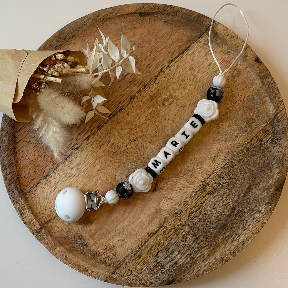 Attache tétine fleur