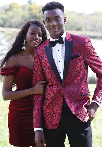 Red paisley tux with black lapels, rental available near me.