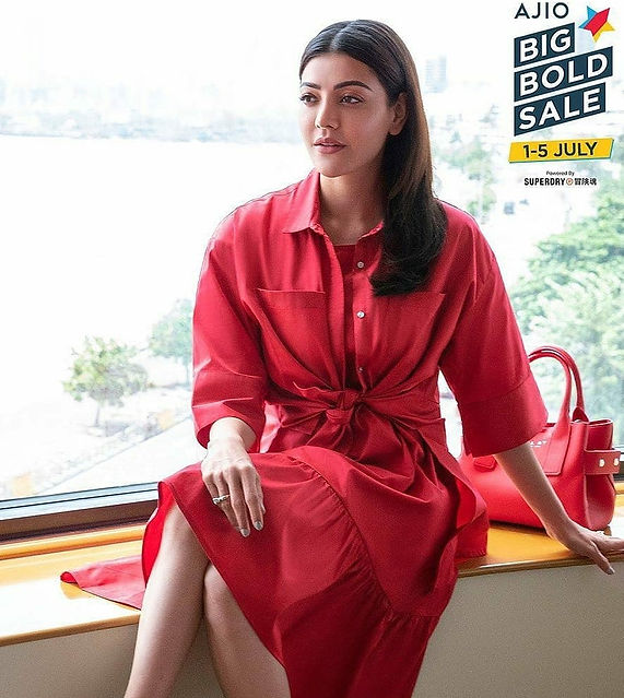 Advertising work for Ajio Brand with celebrity Kajal Agarwal. Posing with beautiful Red dress & reb handbag.