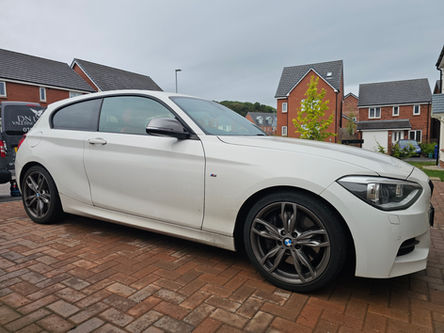 White BMW 1 Series before professional machine polishing