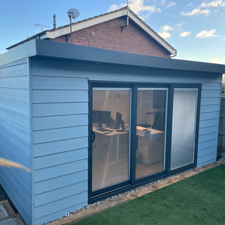 Steel Frame Garden Room Sawbridgeworth with blue fiber cement board cladding