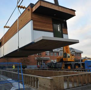 image showing modular building being craned into position 