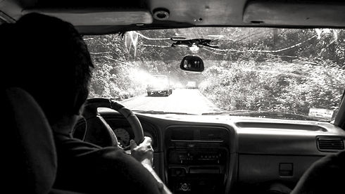 Person driving on a dirt road