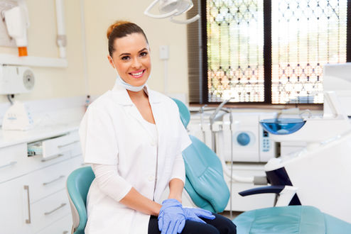 Female Dentist Smiling - we train dental staff