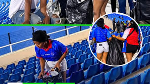 Après la victoire, des supporters haïtiens posent un geste de respect au stade