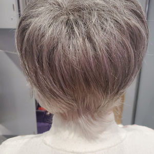 a person's back with grey hair