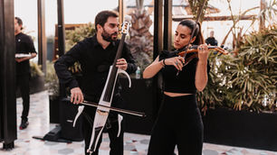 CaboStrings violin and cello duo performing at a luxury wedding in Los Cabos