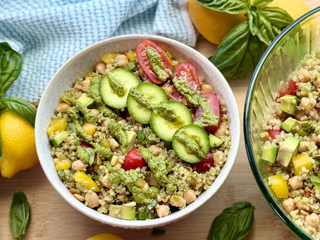 A bowl of quinoa salad with lemons and basil
