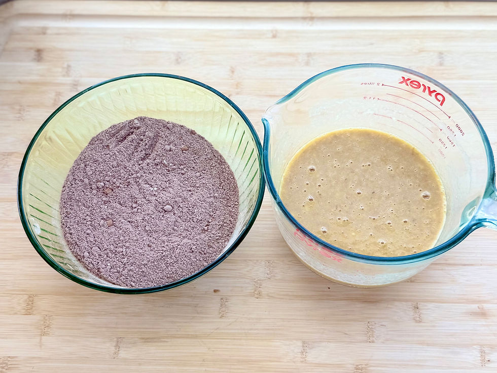 Two glass measuring bowls on a wooden board, one with dry ingredients and one with wet ingredients for Gluten-Free Double Chocolate Banana Bread