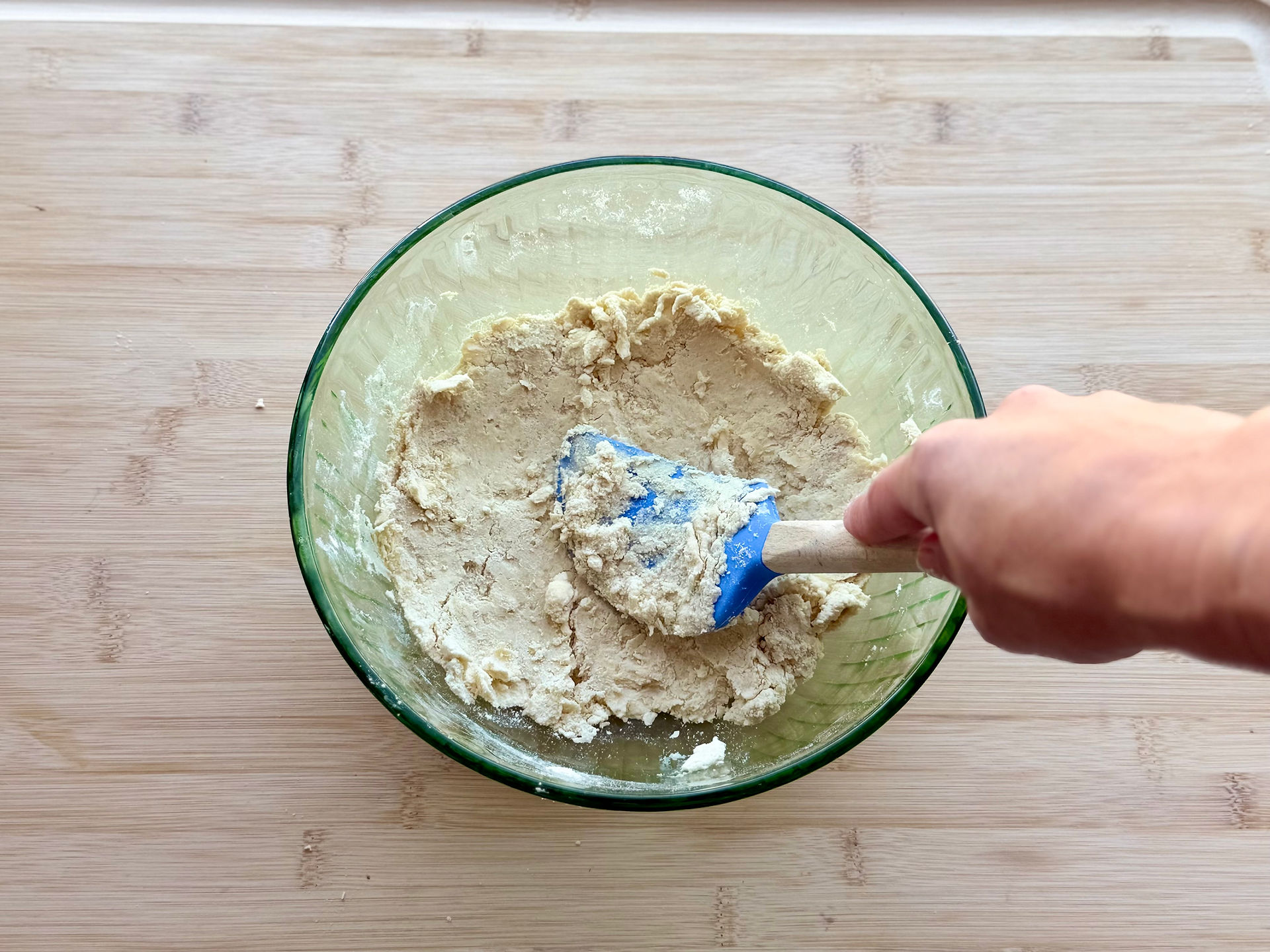 gluten free chicken pot pie crust being pressed with a spatula