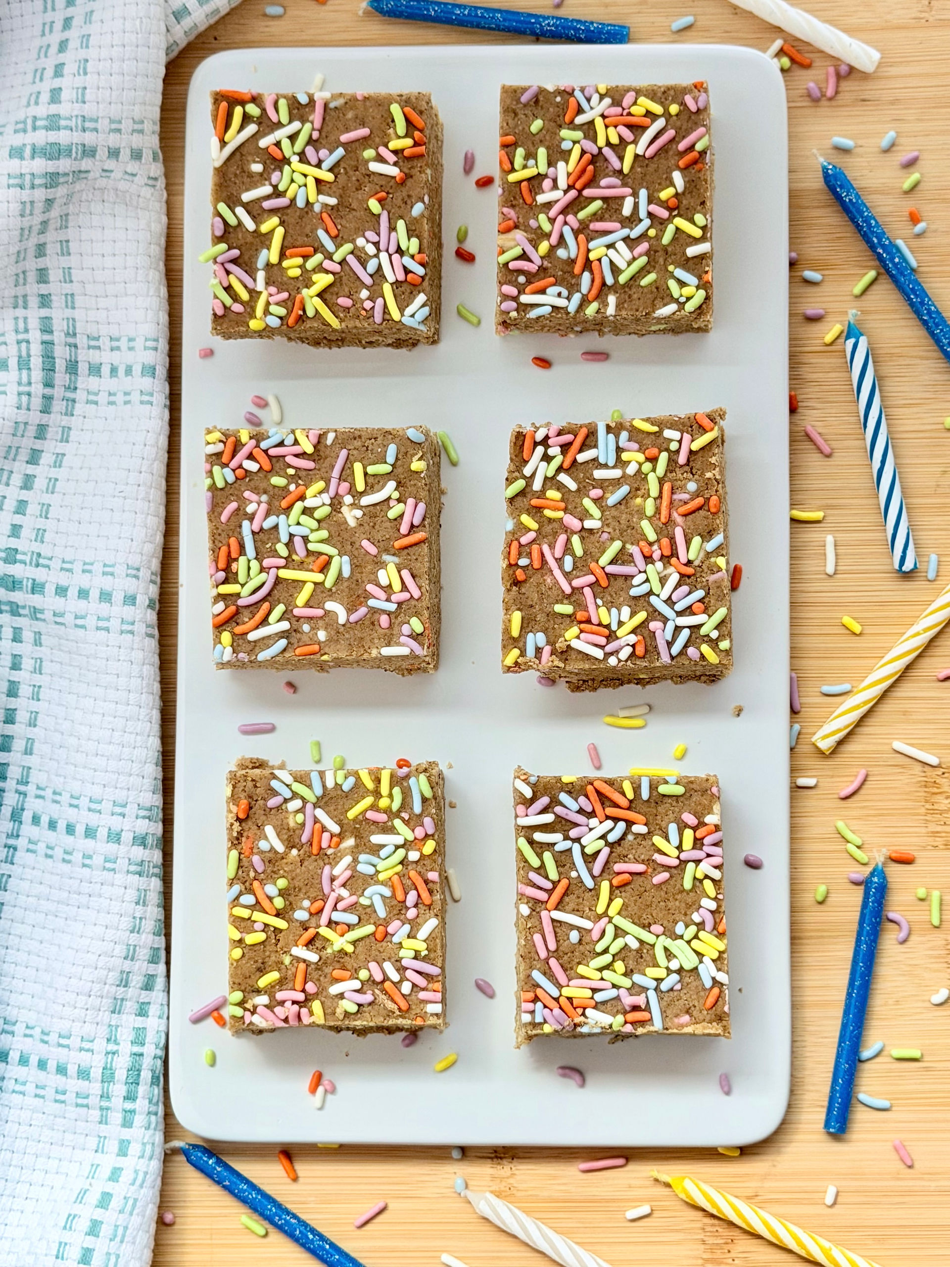 birthday cake protein bar dough cut into squares