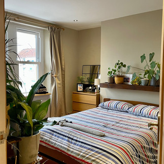 clean bedroom with stripey duvet