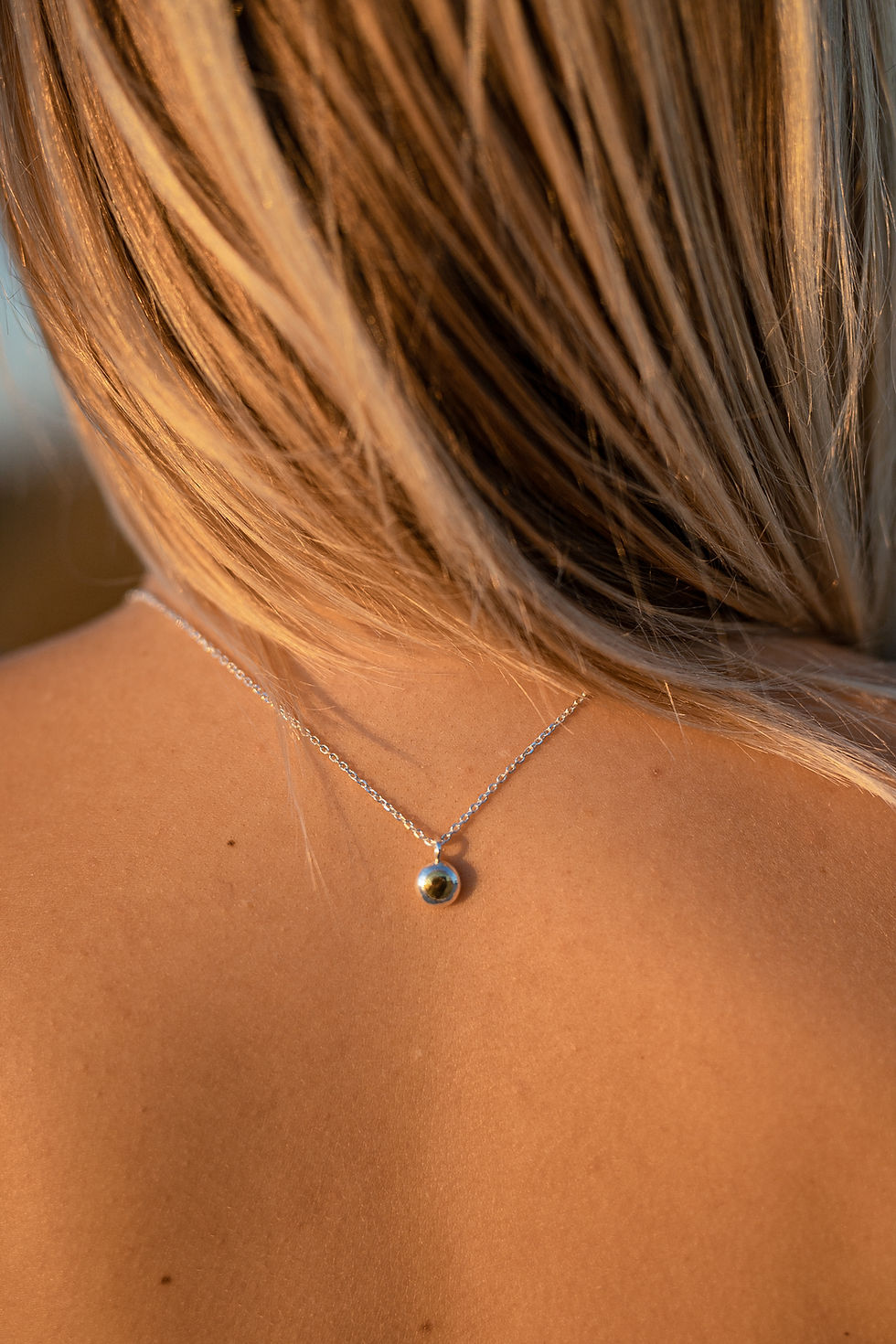 22k Gold Drop Pendant on blonde girl