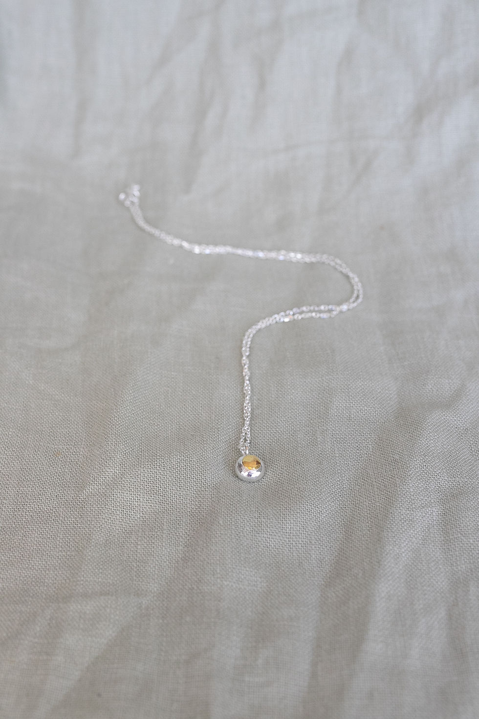 Thumbnail: Close up photo of Gold Pendant