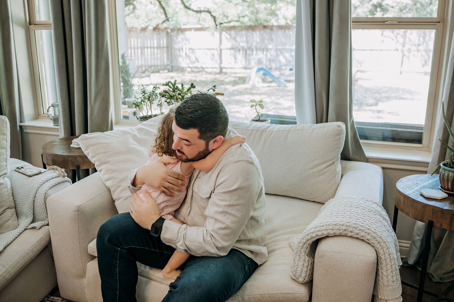 dad and daughter hugging