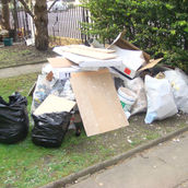 "A team clearing out junk and unwanted items from a garage in South Croydon, South London, providing fast and efficient 24/7 garage clearance services."