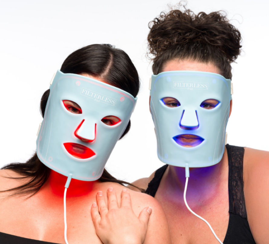 Thumbnail: Two models wearing LED skin revitalizing face masks with red light and blue light therapies activated