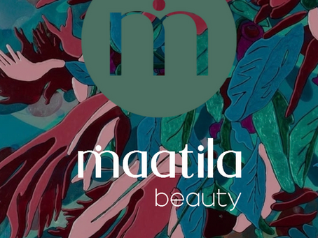 Maatila Beauty and Art by Laura Hallen pop-up shop event graphic for June 20th from 9AM to 1PM. The background features a vibrant abstract botanical painting by Laura Hallen with deep teal, pink, and burgundy organic leaf shapes, overlaid with the green Maatila Beauty logo icon.