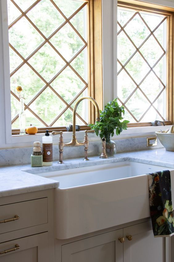 Apron front farm sink with gorgeous faucet.