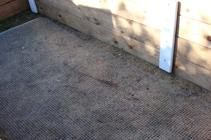 Hardware cloth at the bottom of the raised beds.