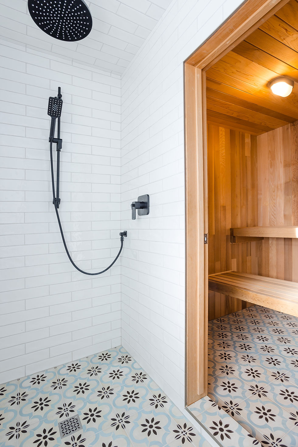 A gorgeous sauna and shower room with cement tiles in blue.