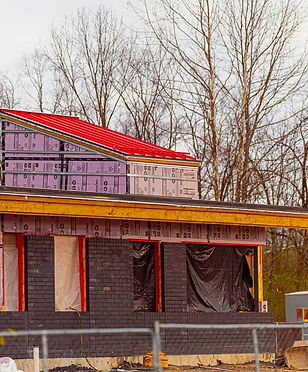 Fire Station 6 under construction in Elkhart Indiana with framed structure, insulation panels, and roofing in progress