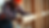 Close-up view of a contractor inspecting a wooden beam for quality