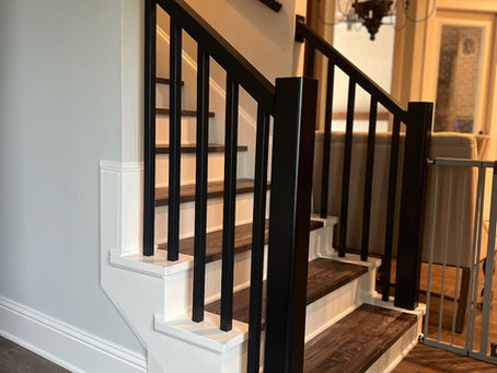 Staircase with dark handrails and balusters with light stairs
