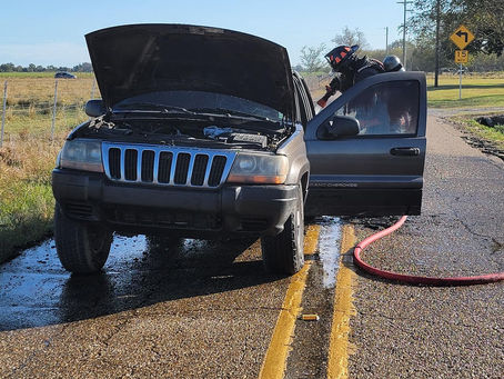 Mire firefighters working a vehicle fire in Acadia Parish