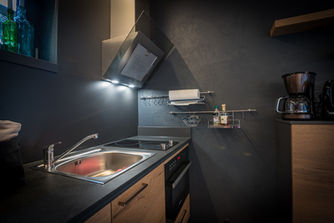 Spüle und Elektroherd im Chalet Feuerzauber