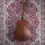 Thumbnail: Full-length Taylor GS Mini acoustic guitar on red and cream patterned rug