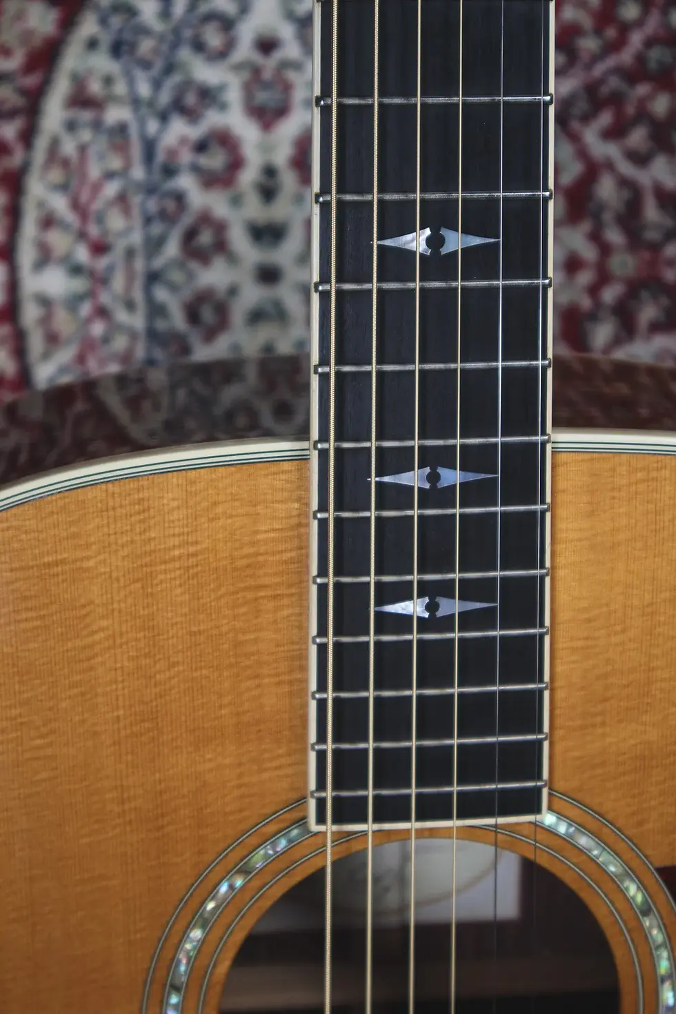 Thumbnail: Fretboard showing inlays on Taylor 810 dreanought guitar