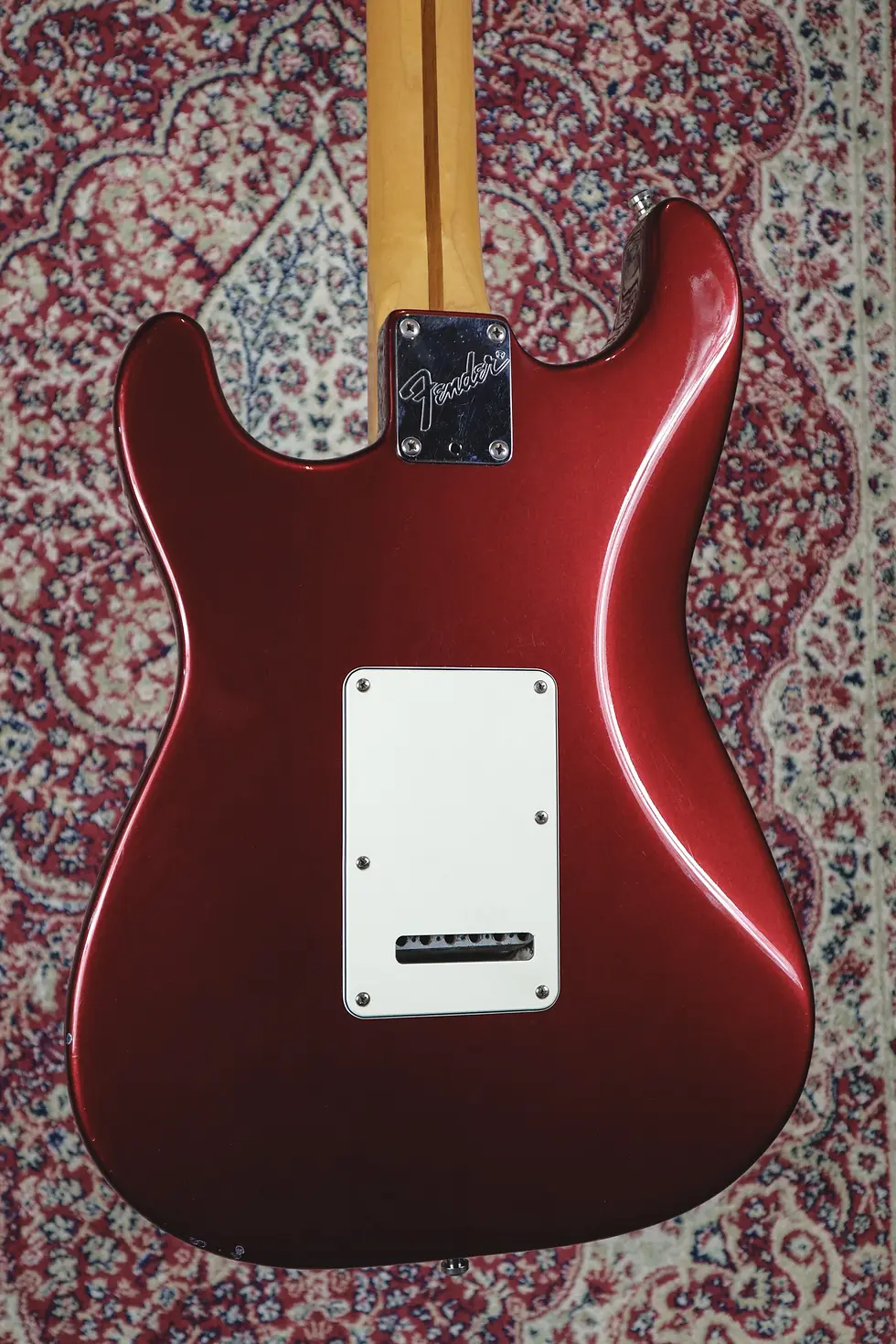 Thumbnail: Full rear view of 1989 Fender Stratocaster Plus in Candy Apple Red on rug