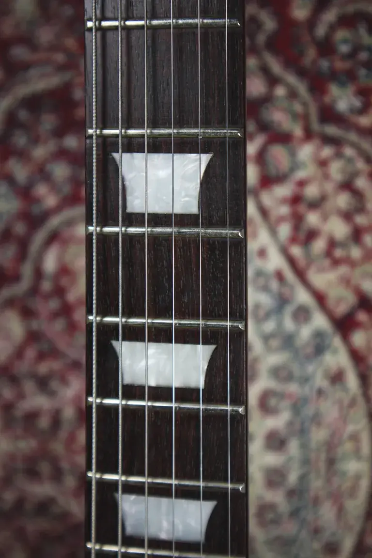 Thumbnail: Epiphone SG Korina rosewood fingerboard trapezoid inlays close-up