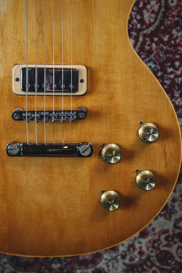 Thumbnail: Lower body view on Gibson Les Paul Deluxe, 1973 showing controls and bridge