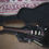Thumbnail: Fender Stratocaster Mexican Deluxe guitar in black finish resting in a hardcase with plush interior