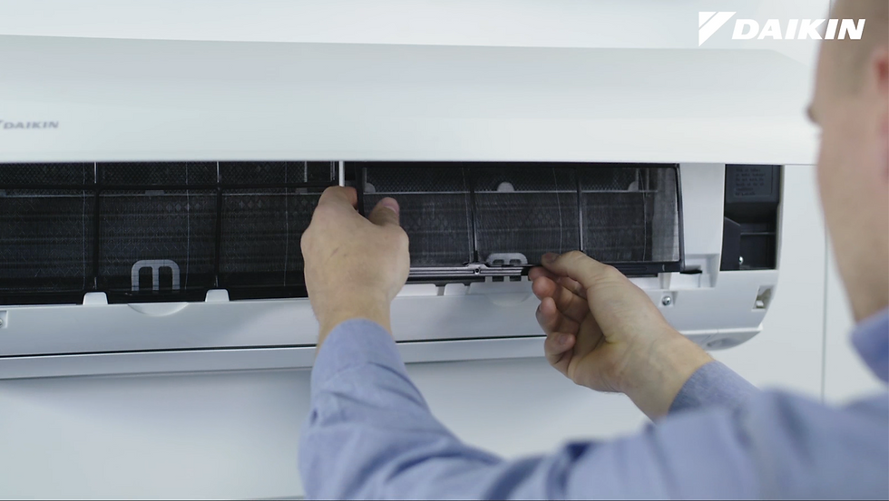 Daikin Service Technician Cleaning Split System Filter