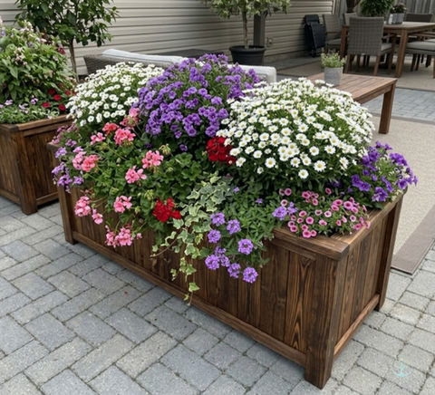Durable burnt wood planter box with vibrant flowers, ideal for a commercial patio or residential garden