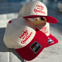 Corks are for Quitters in bold fond on two tone hat